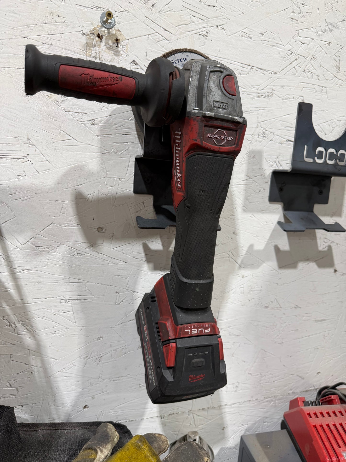 Grinder Hanger with integrated extension cord hanger